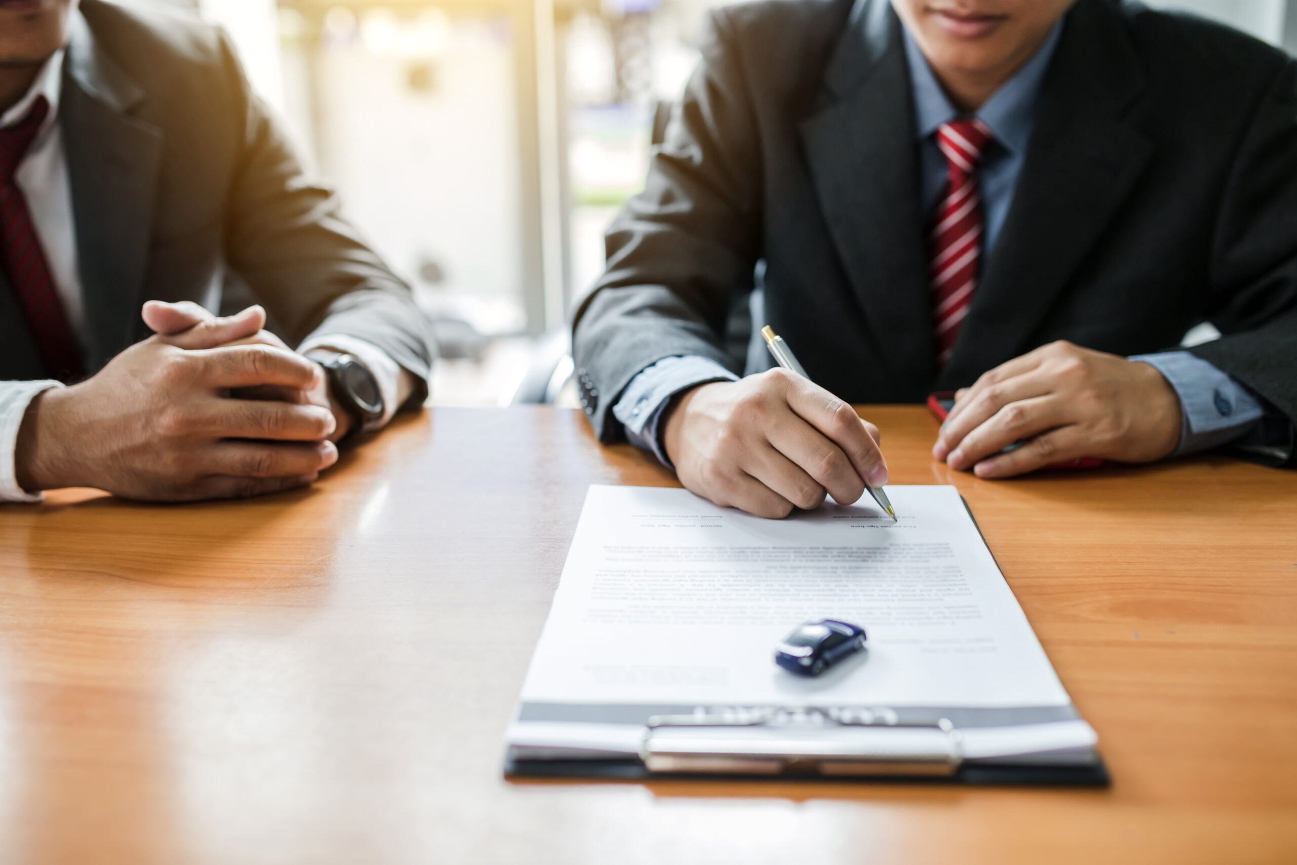 Signing a contract Rent or buy car.